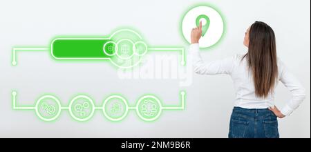 Businesswoman in white office sirt standing and pressing virtual button with her finger. Women presenting new technologies for future. Futuristic Stock Photo