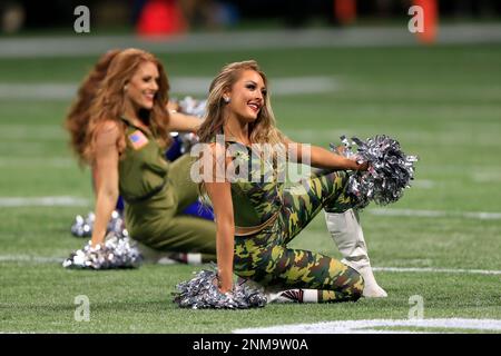 ATLANTA, GA - NOVEMBER 18: Falcons mascot Freddie shoots t-shirts into the  crowd before the Thursday night NFL game between the Atlanta Falcons and  the New England Patriots on November 18, 2021