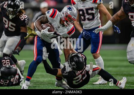 ATLANTA, GA – NOVEMBER 18: Atlanta free safety Erik Harris (23) gets  low-five from Freddie the Falcon prior to the start of the NFL game  between the New England Patriots and the