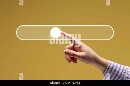 A female hand and a virtual loading bar icon for input and search of information Stock Photo