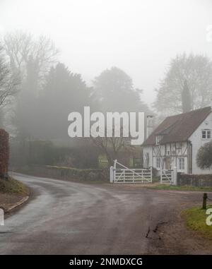A foggy winter morning in the village of Graffham at the foot of the South Downs, West Sussex, England, UK Stock Photo