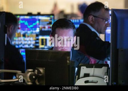 New York, USA. 24th Feb, 2023. Traders work on the floor of the New York Stock Exchange (NYSE) in New York, the United States, on Feb. 24, 2023. U.S. stocks ended lower on Friday. The Dow decreased 1.02 percent to 32,816.92, the S&P 500 sank 1.05 percent to 3,970.04, and the Nasdaq fell 1.69 percent to 11,394.94. Credit: Michael Nagle/Xinhua/Alamy Live News Stock Photo