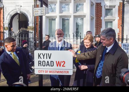 London, UK. 24th February 2023. R-L: Vadym Prystaiko, Ambassador of Ukraine in the UK, his wife Inna Prystaiko, and Westminster Councillors Adam Hug and James Small-Edwards unveil a Kyiv Road sign opposite the Russian Embassy in London. A section of Bayswater Road near the embassy has been renamed Kyiv Road to mark the first anniversary of the war with Russia. Stock Photo