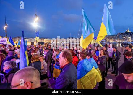 Marseille, France. 24th Feb, 2023. Protesters hold flags during the anniversary rally for peace in Ukraine. On the anniversary of the Russian attack on Ukraine, activists and the Ukrainian community living in Marseilles (France) gathered in front of the town hall of Marseilles to protest against this war and hope to see an end to it. Credit: SOPA Images Limited/Alamy Live News Stock Photo