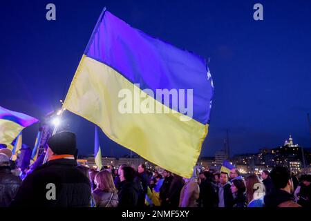 Marseille, France. 24th Feb, 2023. Ukrainian flag seen during the anniversary rally for peace in Ukraine. On the anniversary of the Russian attack on Ukraine, activists and the Ukrainian community living in Marseilles (France) gathered in front of the town hall of Marseilles to protest against this war and hope to see an end to it. Credit: SOPA Images Limited/Alamy Live News Stock Photo