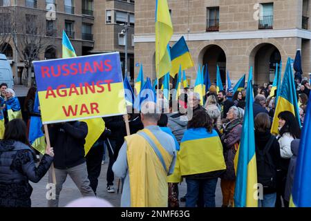 Marseille, France. 24th Feb, 2023. Demonstrators hold a placard and flags during the anniversary rally for peace in Ukraine. On the anniversary of the Russian attack on Ukraine, activists and the Ukrainian community living in Marseilles (France) gathered in front of the town hall of Marseilles to protest against this war and hope to see an end to it. Credit: SOPA Images Limited/Alamy Live News Stock Photo