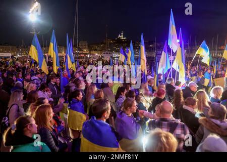 Marseille, France. 24th Feb, 2023. Protesters hold flags during the anniversary rally for peace in Ukraine. On the anniversary of the Russian attack on Ukraine, activists and the Ukrainian community living in Marseilles (France) gathered in front of the town hall of Marseilles to protest against this war and hope to see an end to it. (Photo by Denis Thaust/SOPA Images/Sipa USA) Credit: Sipa USA/Alamy Live News Stock Photo