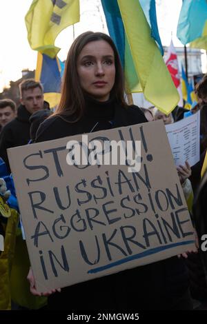 London, UK. 24th Feb 2023. London, UK. People march to protest at the Russian Embassy following an Ecumenical Memorial  Service at the Statue of Saint Volodymyr in Holland Park. The service, on the one year anniversary of Russia's Invasion of Ukraine, is held to remember those who lost their lives during this war. Credit: Kiki Streitberger /Alamy Live News Stock Photo