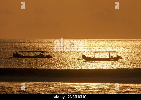 Canoe Kuta Beach sunset Stock Photo - Alamy