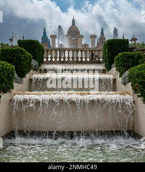 Fountain with water fountains in front of the National Museum of Catalonia in Montjuic, Barcelona, Catalonia, Spain Stock Photo