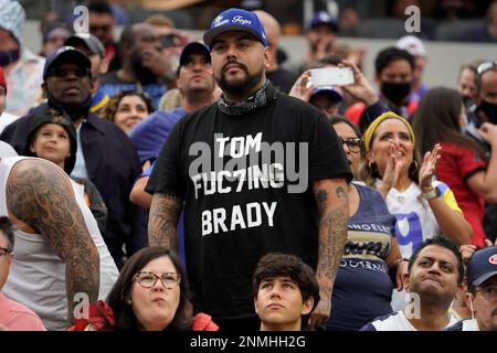 A Los Angeles Rams fan wearing an Aaron Donald jersey sits next to his  photo cutout during the Rams' NFL football practice in Inglewood, Calif.,  Thursday, June 10, 2021. (Keith Birmingham/The Orange