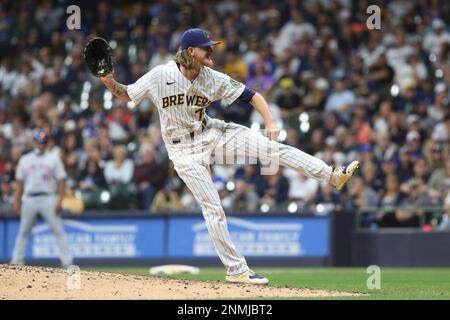 MILWAUKEE, WI - SEPTEMBER 25: Milwaukee Brewers radio play by play  announcer Bob Uecker uses a pitching machine to make a ceremonial first  pitch during a game between the Milwaukee Brewers and