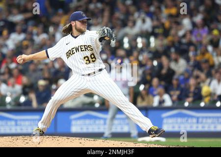 MILWAUKEE, WI - SEPTEMBER 25: Milwaukee Brewers radio play by play  announcer Bob Uecker uses a pitching machine to make a ceremonial first  pitch during a game between the Milwaukee Brewers and