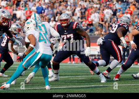 New England Patriots offensive tackle Trent Brown (77) reacts during the  first half of an NFL pre-season football game against the Houston Texans,  Thursday, Aug. 10, 2023, in Foxborough, Mass. (AP Photo/Greg