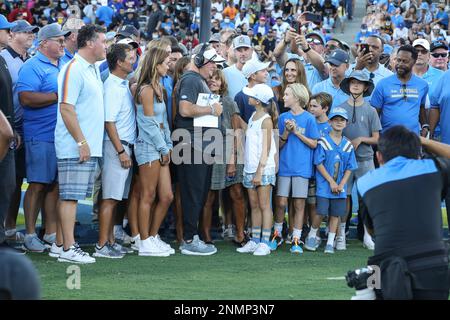 Former LSU head football coach, Ed Orgeron, right, talks to his girlfriend  Bailie Lauderdale during the third quarter of an NCAA college football game  between Texas A&M and Miami on Saturday, Sept.