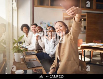 Selfie, friends and memory with a business team working in the boardroom of their corporate workplace. Teamwork, profile picture and startup with a Stock Photo
