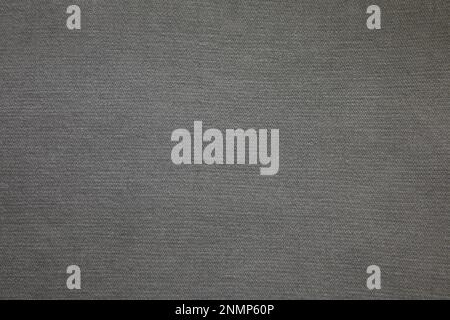 Grey jeans fabric background texture. Grey jeans fabric cloth textile material. Stock Photo