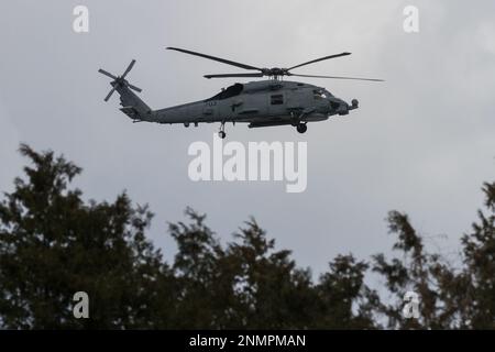 A Sikorsky SH-60 Seahawk helicopter with the US Navy Helicopter Maritime Strike Squadron (HSM-51, known as the War Lord) flying near NAF Atsugi, Japan Stock Photo