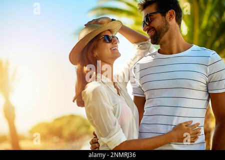 Loving you makes me so happy. an affectionate young couple enjoying a summers day outdoors. Stock Photo