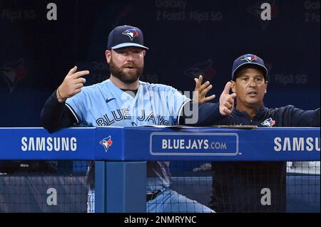 Toronto Blue Jays manager John Schneider (L) and bench coach Don