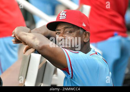 St. Louis Cardinals Hall-of-Famer Ozzie Smith gestures to his longtime  friend and teammate, assistant coach Willie McGee, on the Cardinals bench  before a baseball game between the Cardinals and the Kansas City