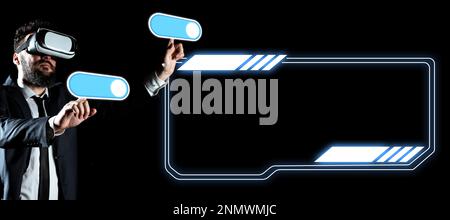 Businessman in black office suit standing wearing VR glasses and looking at technological message. Man pressing virtual buttons with his both fingers Stock Photo