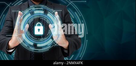 Man in black office shirt standing and holding important technological message between his hands. Futuristic style image with color glow presenting Stock Photo