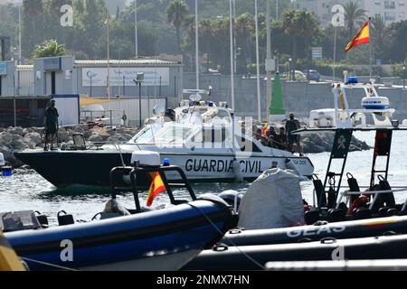 Two Spanish Civil Guard (Guardia Civil) Officers patrol the harbour on the  Spanish island of Tabarca Stock Photo - Alamy