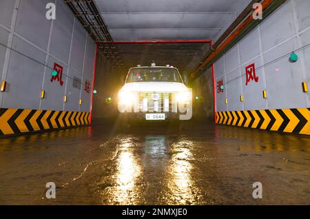 ORDOS, CHINA - FEBRUARY 24, 2023 - A new energy trackless rubber wheel vehicle equipped with a driverless system runs underground at the Shendong Coal Stock Photo