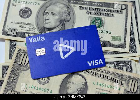 Cairo, Egypt, February 11 2023: Yalla electronic payment wireless and ATM VISA card of Egypt Post used for transactions within Egypt on a pile of an A Stock Photo