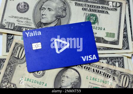 Cairo, Egypt, February 11 2023: Yalla electronic payment wireless and ATM VISA card of Egypt Post used for transactions within Egypt on a pile of an A Stock Photo