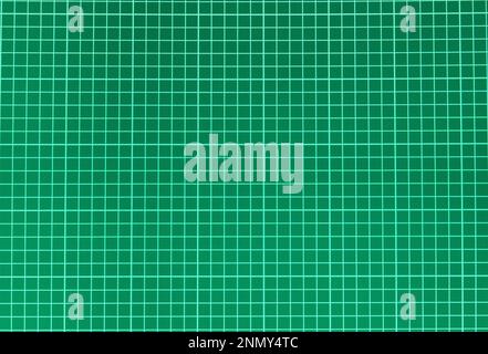 Dark green vignetted background with checkered markup for notes. Space for text Stock Photo