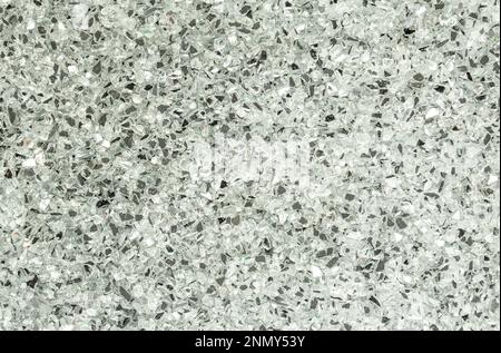 Abstract blurred background of small pebbles in white and gray. Stock Photo