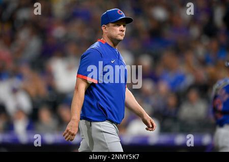 Chicago Cubs bench coach Andy Green, left, wearing a face mask, talks with  Codi Heuer before a baseball game against the Pittsburgh Pirates Friday,  Sept. 3, 2021, in Chicago. Green will skipper