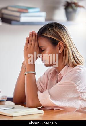 Black woman, praying hands and books for religion, faith and god help, holy support and spiritual guidance in study. Prayer, hope and christian person Stock Photo