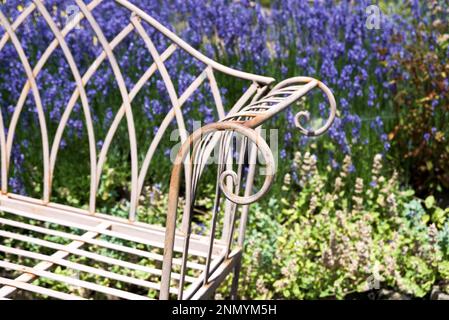 Armrest of rusty metal bench in the garden Stock Photo