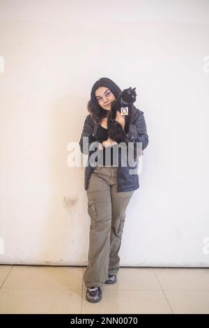 Dhaka, Bangladesh. 24th Feb, 2023. A cat owner shows off her pet cat during the cat ramp show at Jamuna Future Park in Dhaka. This is the first-ever cat ramp show where many cat lovers attended the events. (Photo by Sazzad Hossain/SOPA Images/Sipa USA) Credit: Sipa USA/Alamy Live News Stock Photo