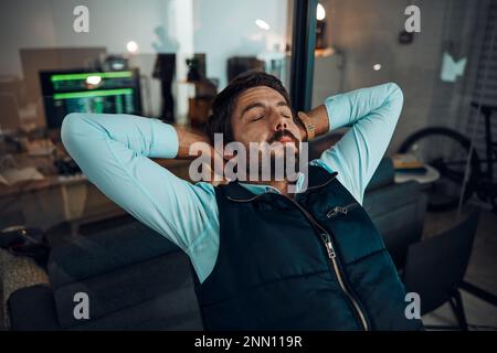 Developer man, relax or peace in home office with hand on head for achievement, thinking about goals or target. Sleeping, night or entrepreneur on Stock Photo
