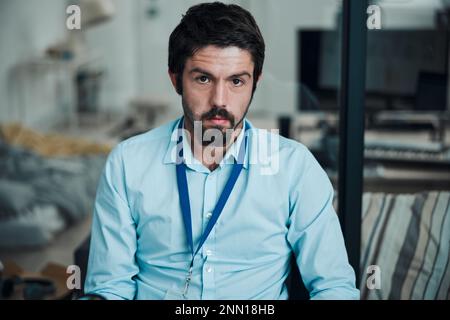 Technician, programmer and portrait of a man in a office for engineering service, maintenance or repairs. Information technology, professional and Stock Photo