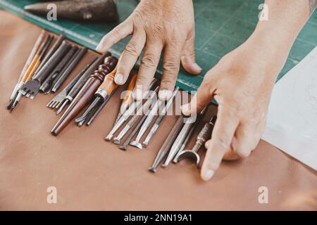 closeup hand tool for leather tailor maker. old handcraft master piece working equipments. Stock Photo