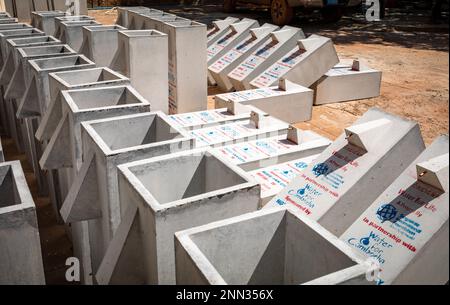 Biosand water filters awaiting finishing in the front yard of office for the charity Water for Cambodia in Siem Reap, Cambodia. Stock Photo