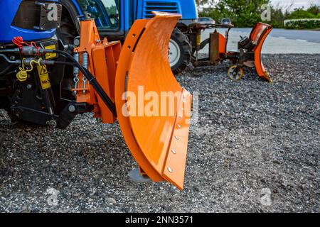 Two orange snow digger bucket. Small snowblower.Snow removal equipment in anticipation of winter. Close-up. Selective focus. Copy space. Stock Photo