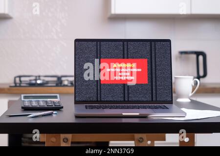 The computer system has been hacked. On the screen warning of unauthorized access. Stock Photo