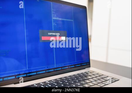 Copying documents from a pc. folders with documents on a laptop computer. Data transfer backup. Stock Photo