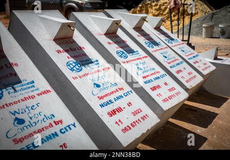 A row of biosand water filters awaiting finishing in the front yard of office for the charity Water for Cambodia in Siem Reap, Cambodia. Stock Photo