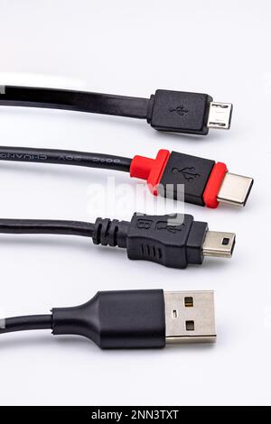 The different USB plugs, cables and standards like USB-A or USB-C often lead to confusion, isolated in the studio Stock Photo