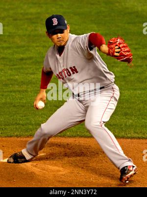 File photo taken in October 2007 shows Boston Red Sox pitcher Daisuke  Matsuzaka holding up the World Series championship trophy in Denver,  Colorado. The two-time World Baseball Classic MVP has decided to