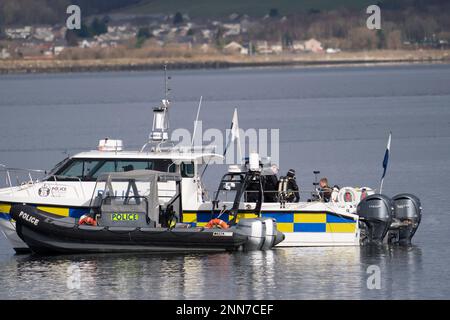 Greenock, Scotland, UK. 25 February 2023. Police and Pilot craft at scene of sinking of the Clyde Marine Services tug Biter that sunk Near East India Harbour in Greenock yesterday .   Two crew members are still missing. Pic; Police divers are working above the sunken tug.  Iain Masterton/Alamy Live News Stock Photo