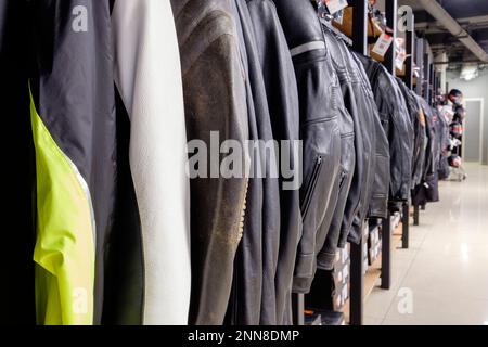 Leather motorbike jackets in a row Stock Photo