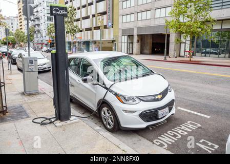 BlueLA Blink mobility sharing system electric car being recharged in a car sharing location in Los Angeles downtonwn Stock Photo